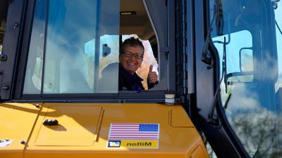 Alfred University administration operating a bulldozer